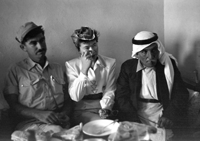 An Israeli officer and Anne Liepah, American Haganah     correspondent, in the house of the Mukhtar (village elder) in Iqrit, 1948 (photographer unknown, Government Press Office. CC BY-NC-SA 2.0).